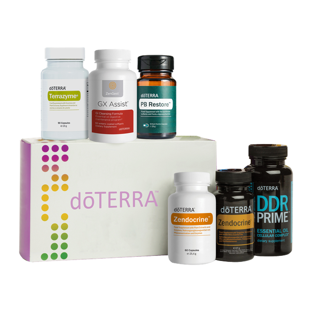 A doTERRA wellness supplement set arranged on a white background, including a large branded box, several white and dark amber bottles, and jars. Visible products include Tetrazyme, GX Assist, PB Restore, Zendocrine, Zndocrine, and DDR Prime.