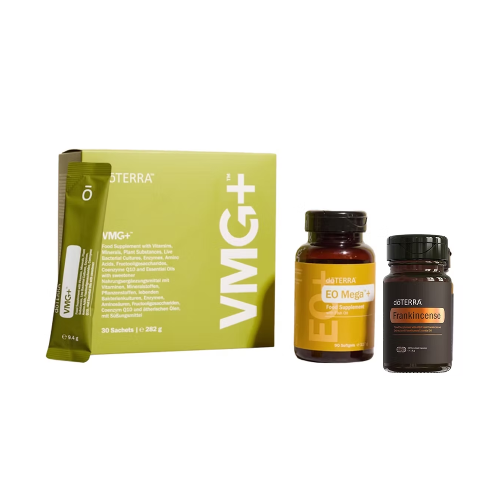A VMG+ supplement kit from DoTerra, featuring a lime green box, a single sachet, a brown bottle labeled EO Mega+ V, and a dark amber bottle labeled Frankincense, arranged on a plain white background.