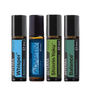 Four döTERRA Touch essential oil blend roller bottles arranged side by side on a white background. The bottles are Whisper, Adaptiv, Shinrin-Yoku, and Balance, each with a black cap and a colored label (blue, dark blue, green, and teal) indicating different blends.