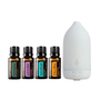 A diffuser and essential oil set on a white background, featuring four amber glass bottles of doTERRA essential oils (Eucalyptus, Lavender, Aromatherapy, Citrus Bliss) and a white electronic diffuser.