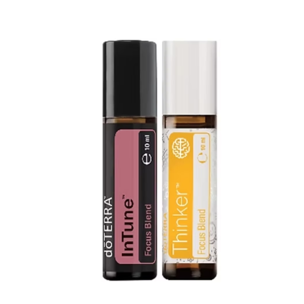 Two doTERRA focus blend roller bottles side by side on a white background: InTune in black with a pink label and Thinker in amber with a yellow label.