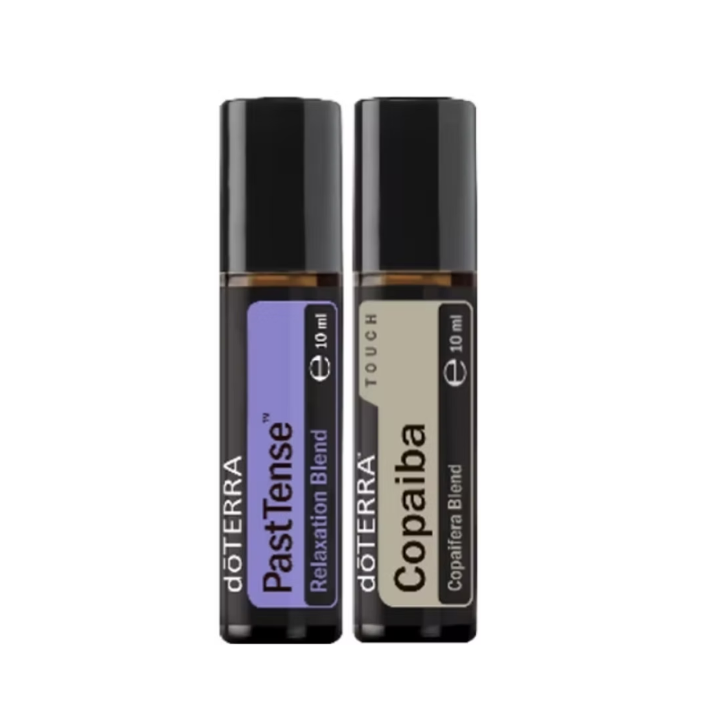 Two 10 ml roll-on bottles of doTERRA essential oil blends, PastTense Relaxation Blend with a purple label and Copaiba Copaliera Blend with a beige label, shown side-by-side on a white background.