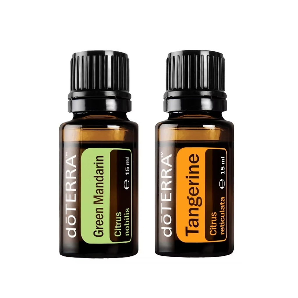 Two amber glass essential oil bottles with black caps on a white background. The left bottle is labeled doTERRA Green Mandarin, and the right bottle is labeled doTERRA Tangerine.