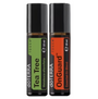 Two 10 ml doTERRA essential oil roller bottles standing side by side on a plain white background. The left bottle is labeled Tea Tree with a green label, and the right bottle is labeled OnGuard with an orange label.