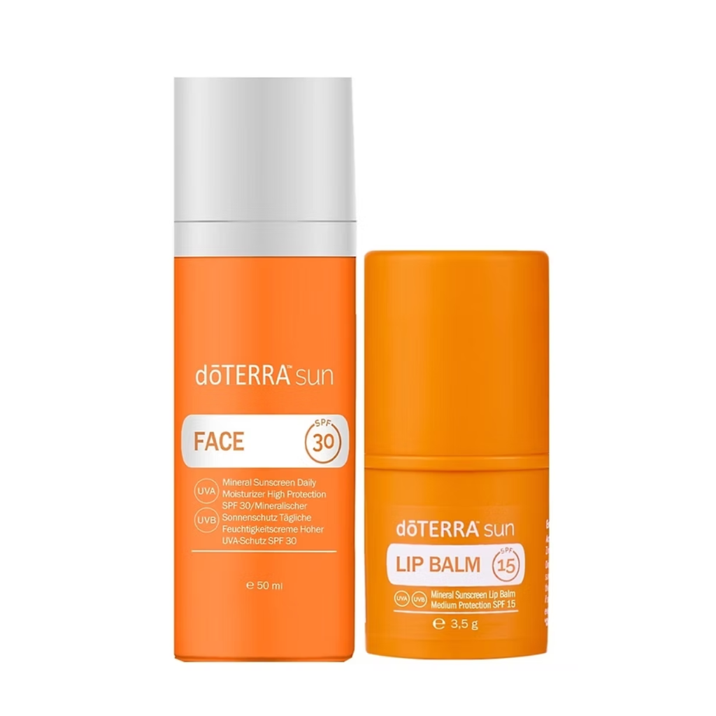Two doTERRA sun skincare products on a plain white background: an orange and white Face Sunscreen SPF 30 bottle and an orange Lip Balm tube.