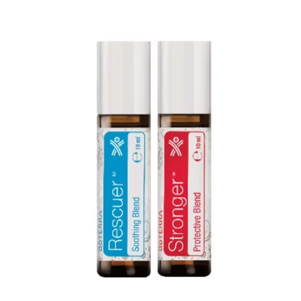Two amber glass roll-on bottles with white caps on a plain white background. The left bottle has a blue label reading 'Rescuer Soothing Blend' and the right bottle has a red label reading 'Stronger Protective Blend'.