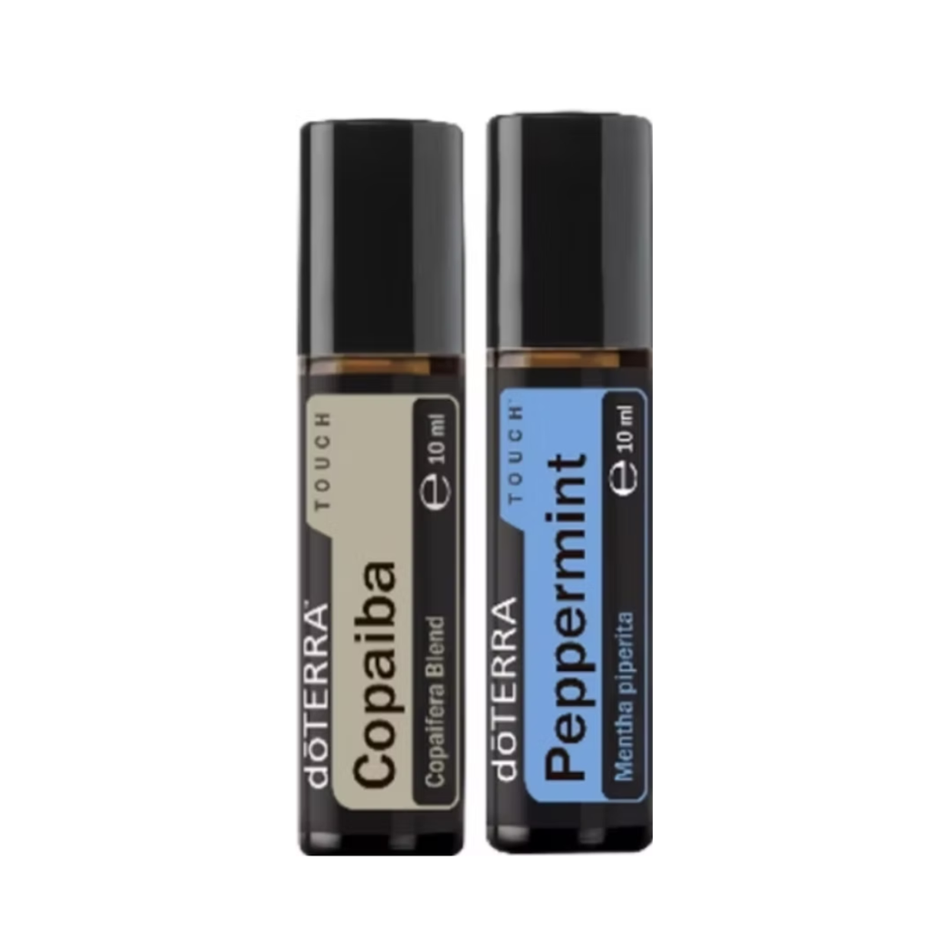 Two doTERRA Touch roll-on essential oil bottles on a white background: Copaiba Blend with a beige label and Peppermint with a blue label.
