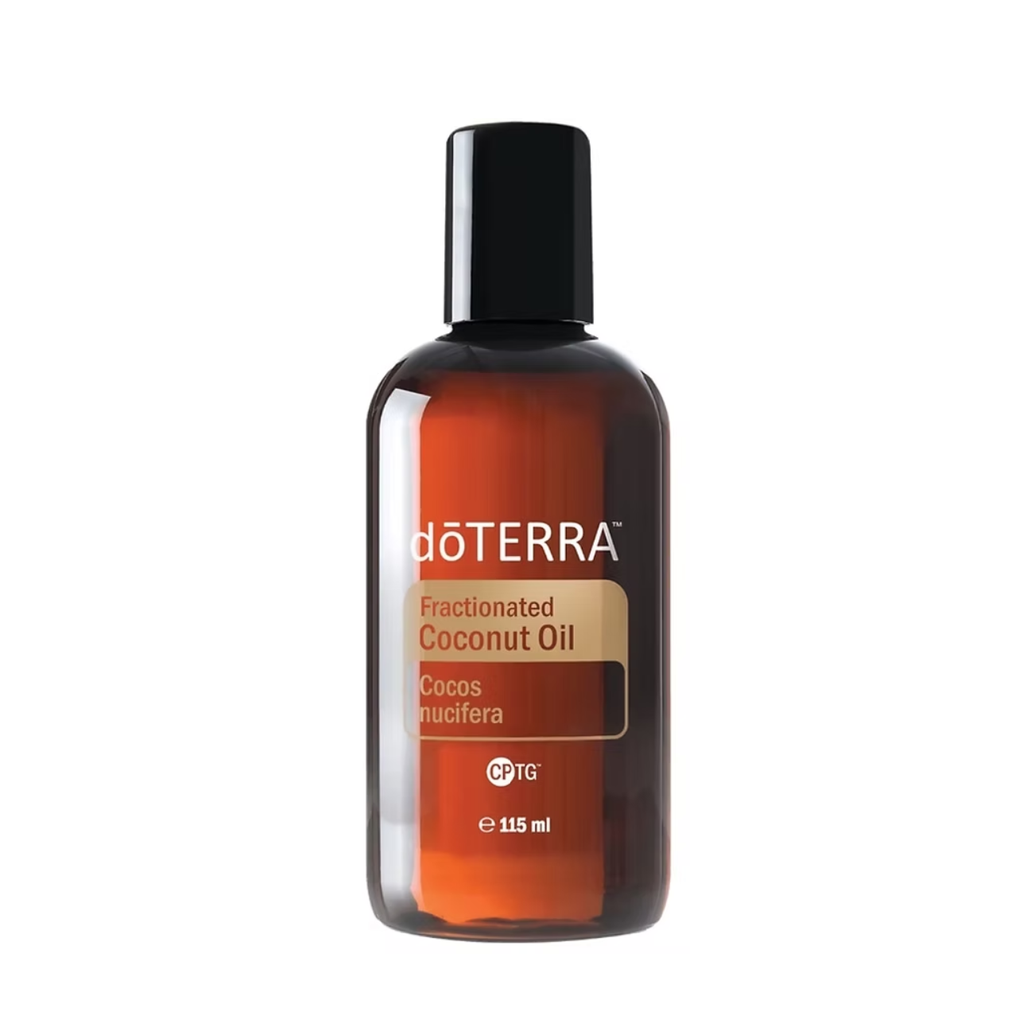 A 115 ml bottle of doTERRA Fractionated Coconut Oil on a solid white background. The bottle is made of amber-brown glass with a black cap and features a beige and orange label.