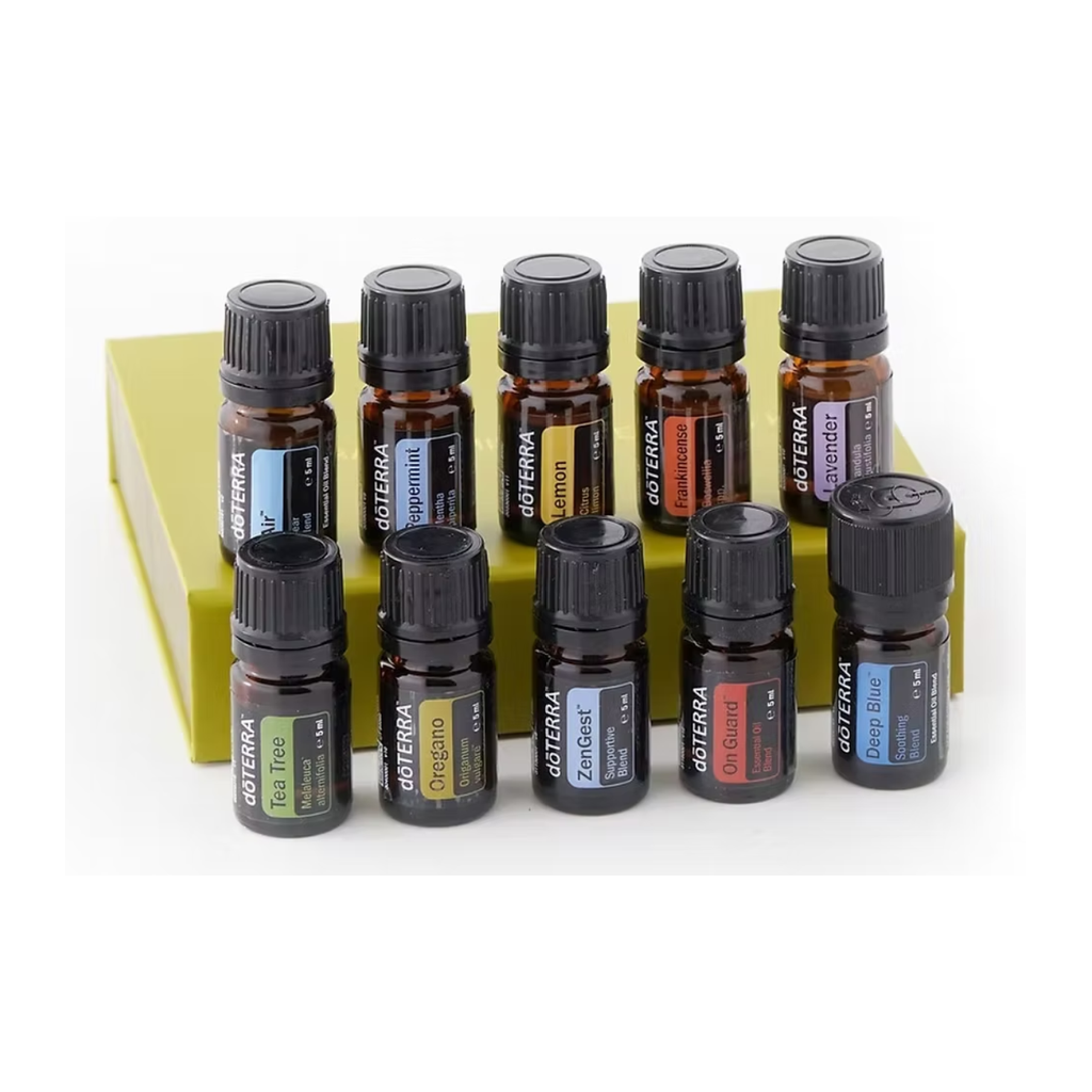 A set of 10 doTERRA essential oil bottles arranged in two rows on top of a yellow-green box, photographed against a clean white background.