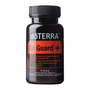 A black plastic bottle of doTERRA On Guard+ dietary supplement with a black ribbed cap and a red and black label, shown on a plain white background.