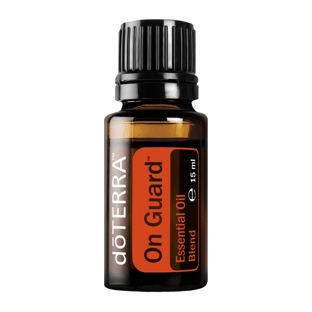 A 15 ml bottle of doTERRA On Guard Essential Oil Blend in an amber glass bottle with a black cap and orange label, shown on a plain white background.