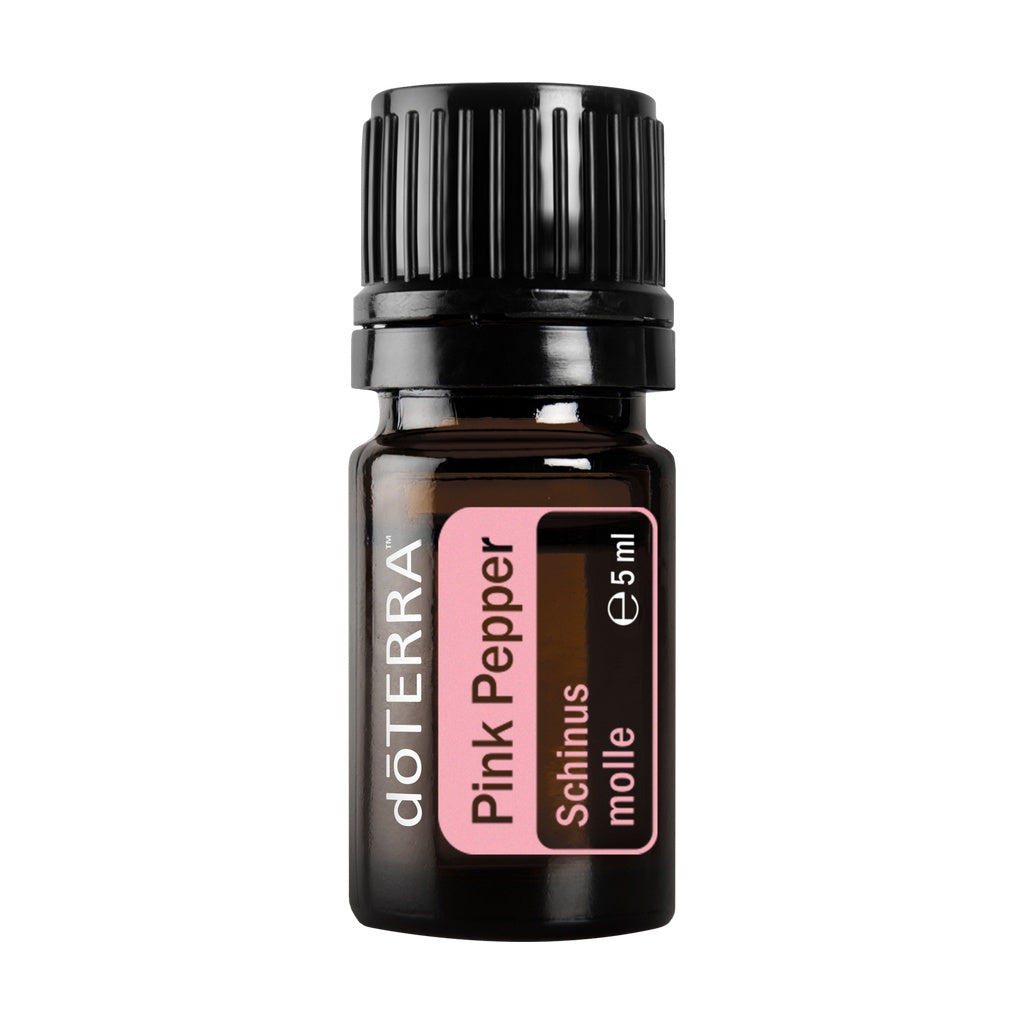 A 5ml amber glass bottle of doTERRA Pink Pepper essential oil with a black ribbed cap and a pink label, shown on a plain white background.