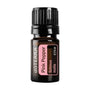 A 5ml amber glass bottle of doTERRA Pink Pepper essential oil with a black ribbed cap and a pink label, shown on a plain white background.