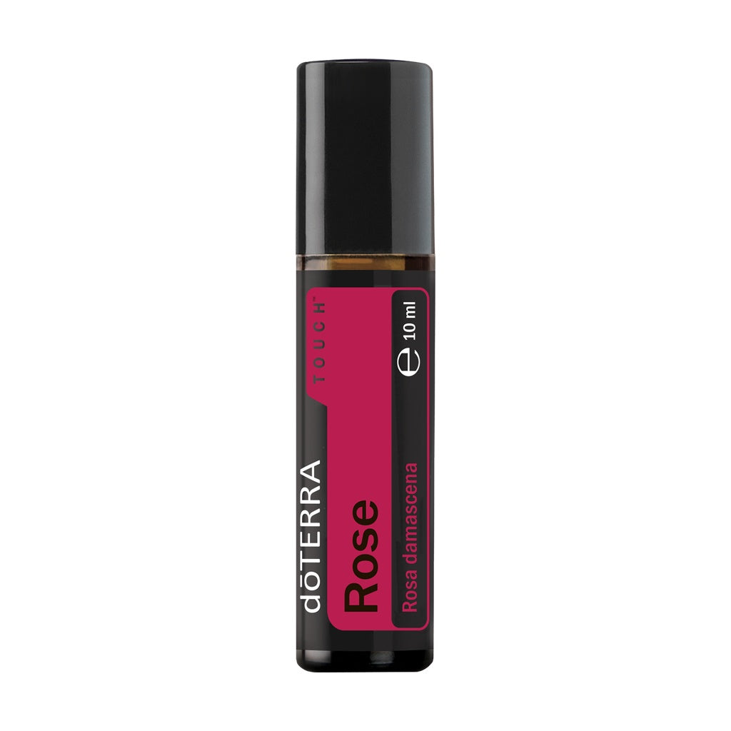 A 10 ml bottle of döTERRA Rose Touch rose damascena essential oil on a solid white background.
