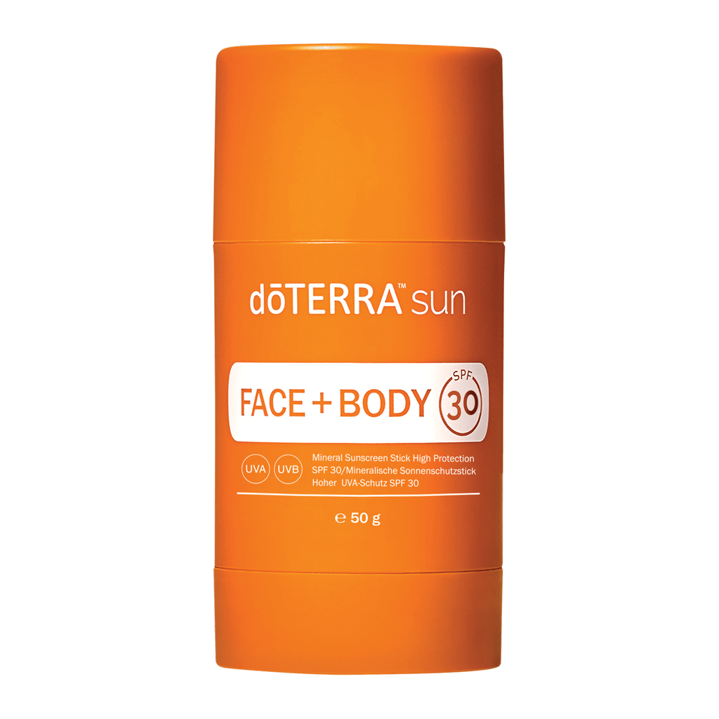 A 50g orange deTERRA sun Face + Body SPF 30 mineral sunscreen stick, shown in its cylindrical cardboard container against a plain white background.