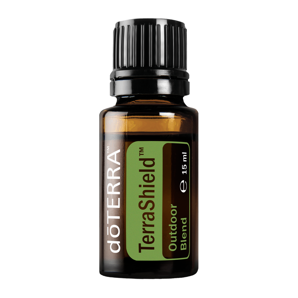 A 15 ml amber glass bottle of doTERRA TerraShield Outdoor Blend essential oil with a black ribbed cap and a green and brown label, shown on a plain white background.