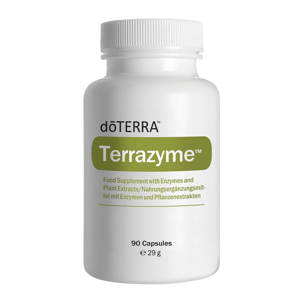 A white plastic bottle of döTERRA Terrazyme food supplement with a white ribbed cap, featuring a green label with white text, on a solid white background.