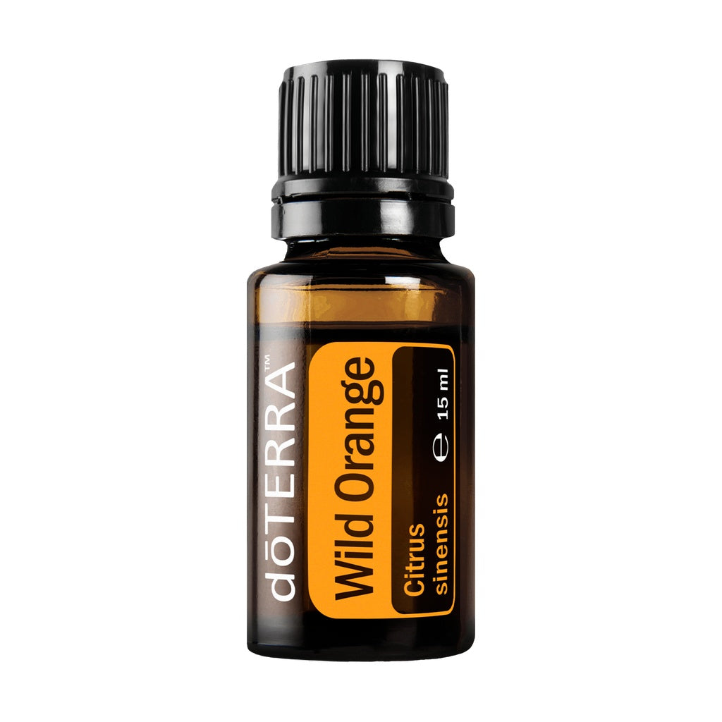 A 15 ml amber glass bottle of doTERRA Wild Orange essential oil with a black ribbed cap and a yellow label, shown on a plain white background.
